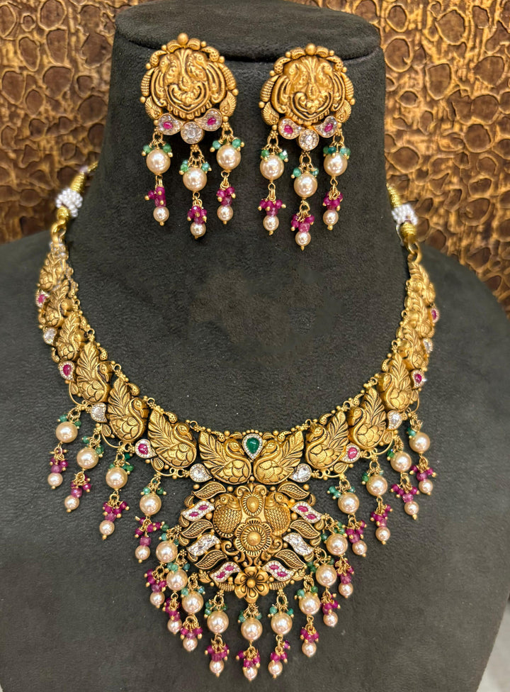 22Kt Gold Antique Double Peacock Floral Grand Choker Set with Pearl-Ruby-Emerald Drops & Ganesha Earrings
