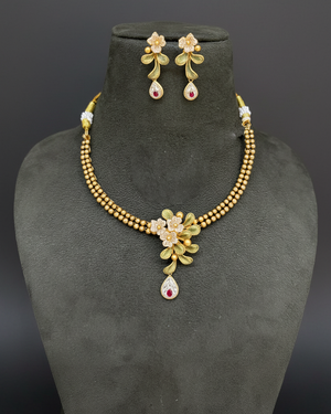 Gold Floral Necklace Set on Velvet Bust