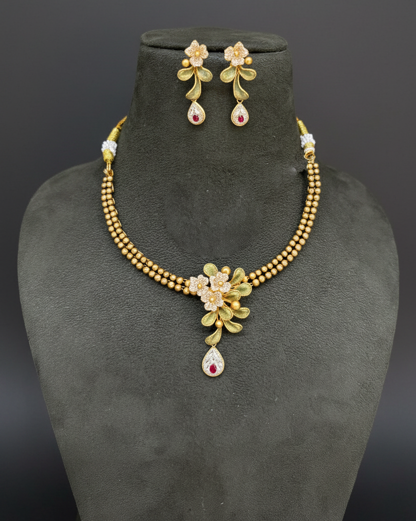 Gold Floral Necklace Set on Velvet Bust