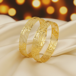 22Kt Multi-Strand Leaf Gold Bangles on satin fabric